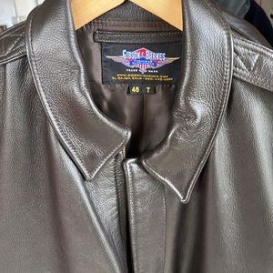 Brown leather flight style jacket with satin lining and epaulets